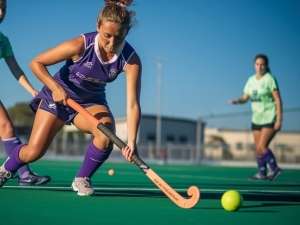 dynamic_action_shot_of_two_women_playing_field_hockey